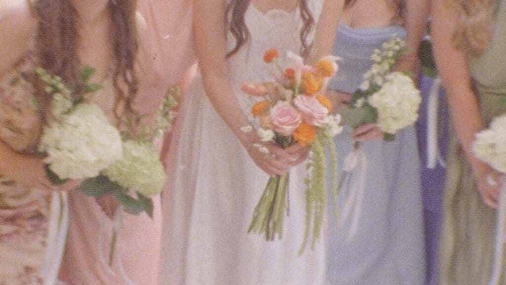 Winston-Salem bridal party in pastels posing with bouquets