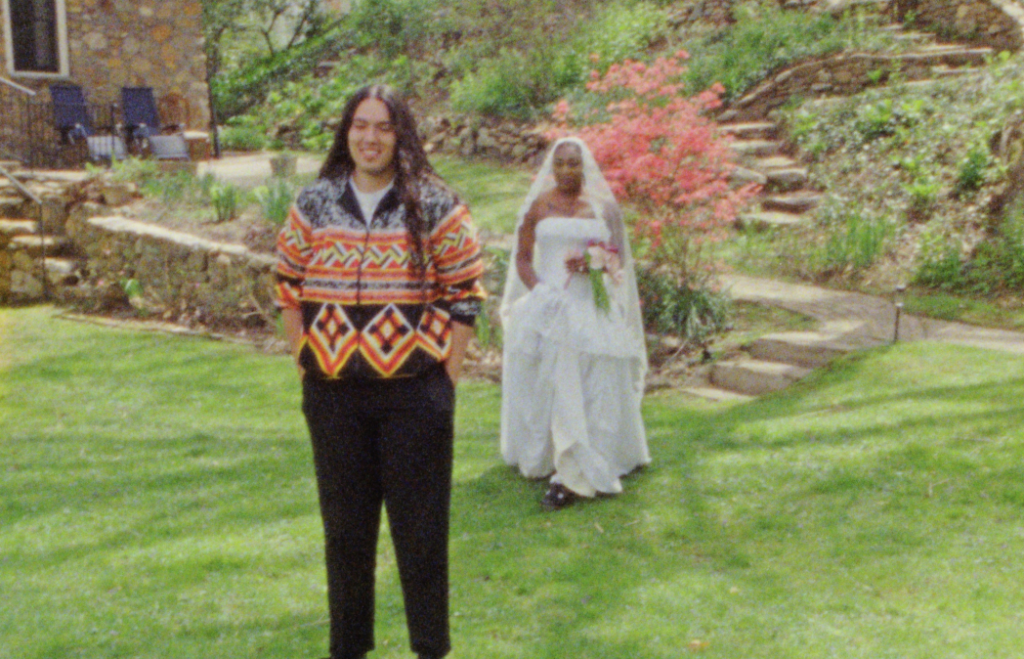 A Super 8mm still frame of the bride walking up to the groom to do their First Look at their Asheville, North Carolina airbnb before their elopement ceremony
