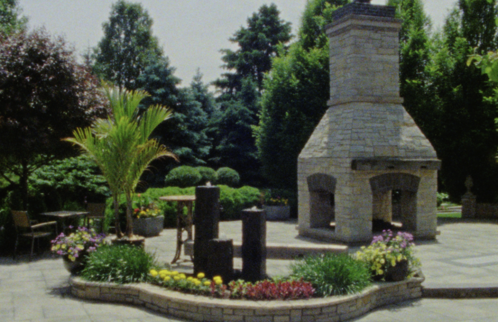 A Super 8mm Still frame of the courtyard at the Farmhouse at Plainfield in the Chicago suburbs