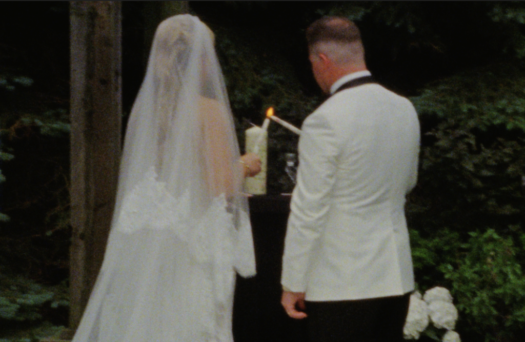 Bride and Groom lighting their unity candle during their ceremony on Super 8mm film in Plainfield, IL