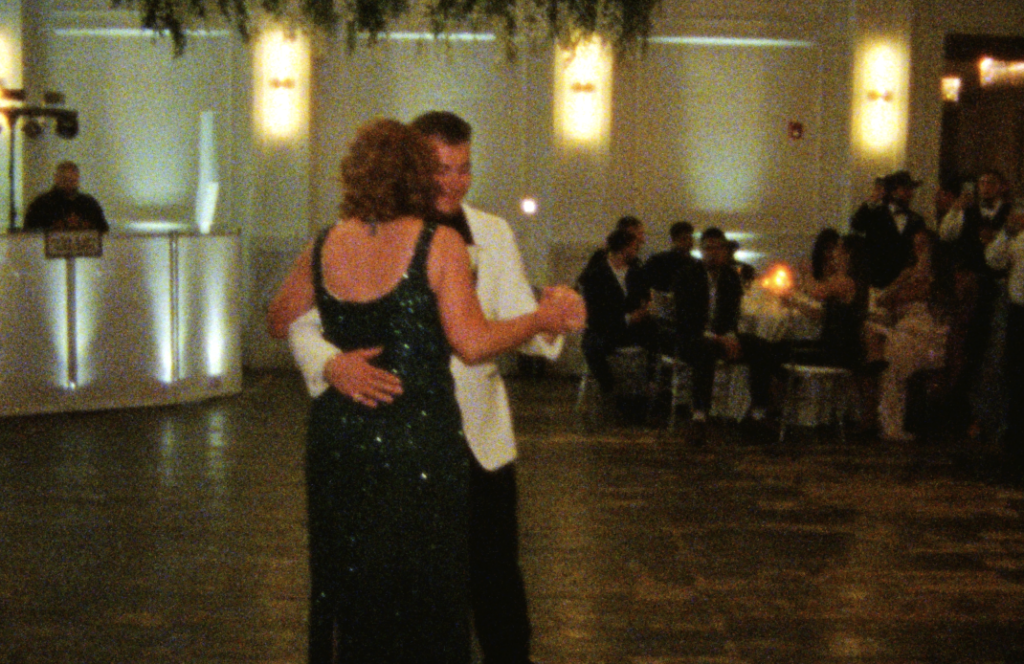A Super 8mm still frame of the groom dancing with his mother